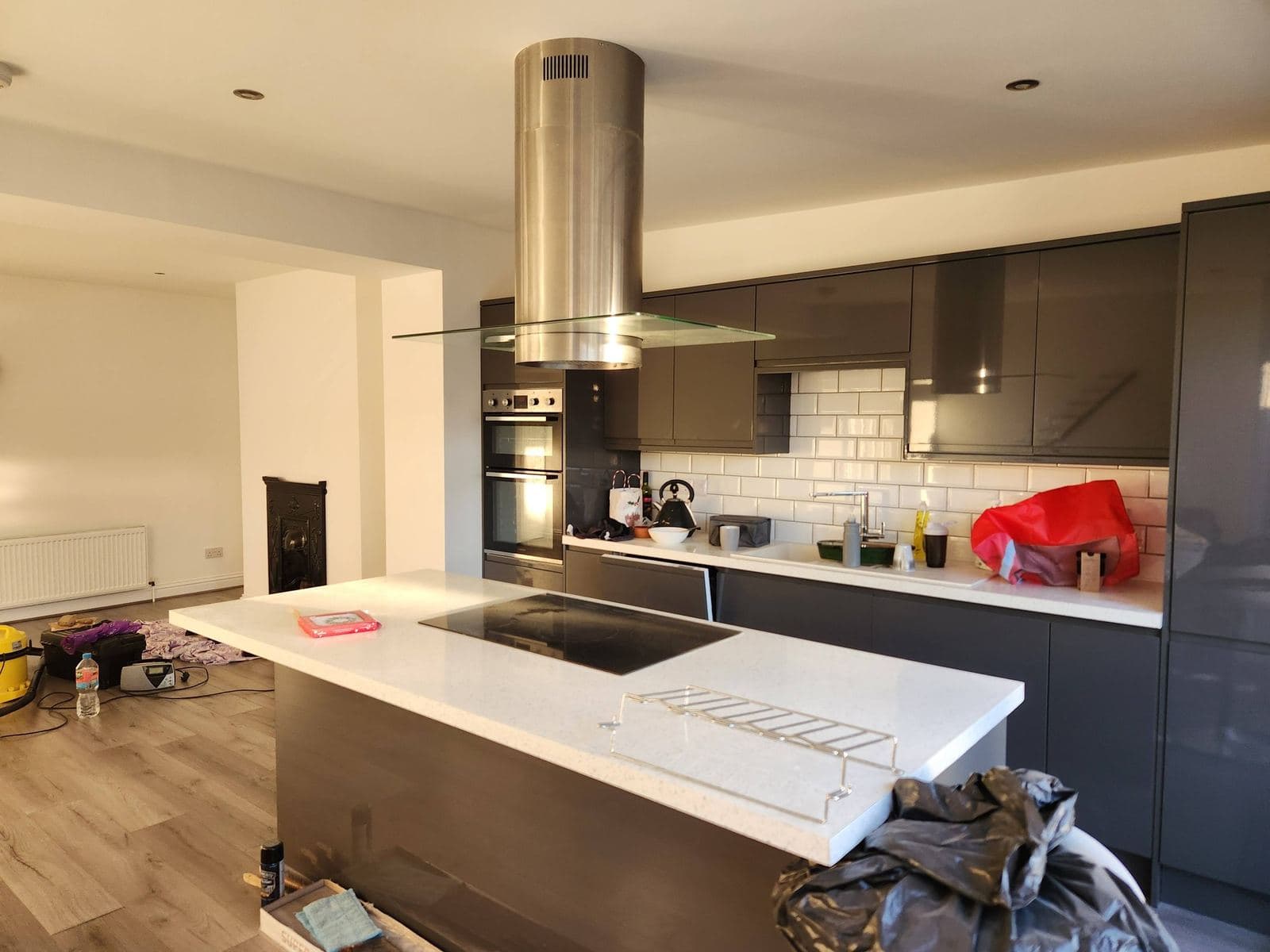 Modern grey kitchen with island, hood and induction hob